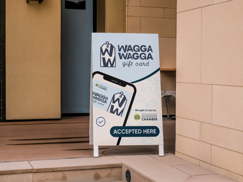 A-frame sign featuring the Wagga Wagga Gift Card logo and "Accepted Here" branding, encouraging local businesses to join the gift card program.
